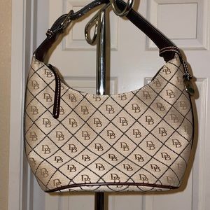 Dooney and Bourke signature bag tan and black monogram. In very good condition.